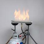 High pressure adjustable regulator installed on a propane tank and burner pan, on a high flame height