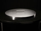 Cover for 19" round pan resting on granite table top