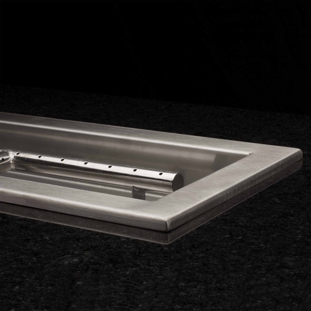 48" x 6" fire pit burner pan with beveled lip in a Granite fire table