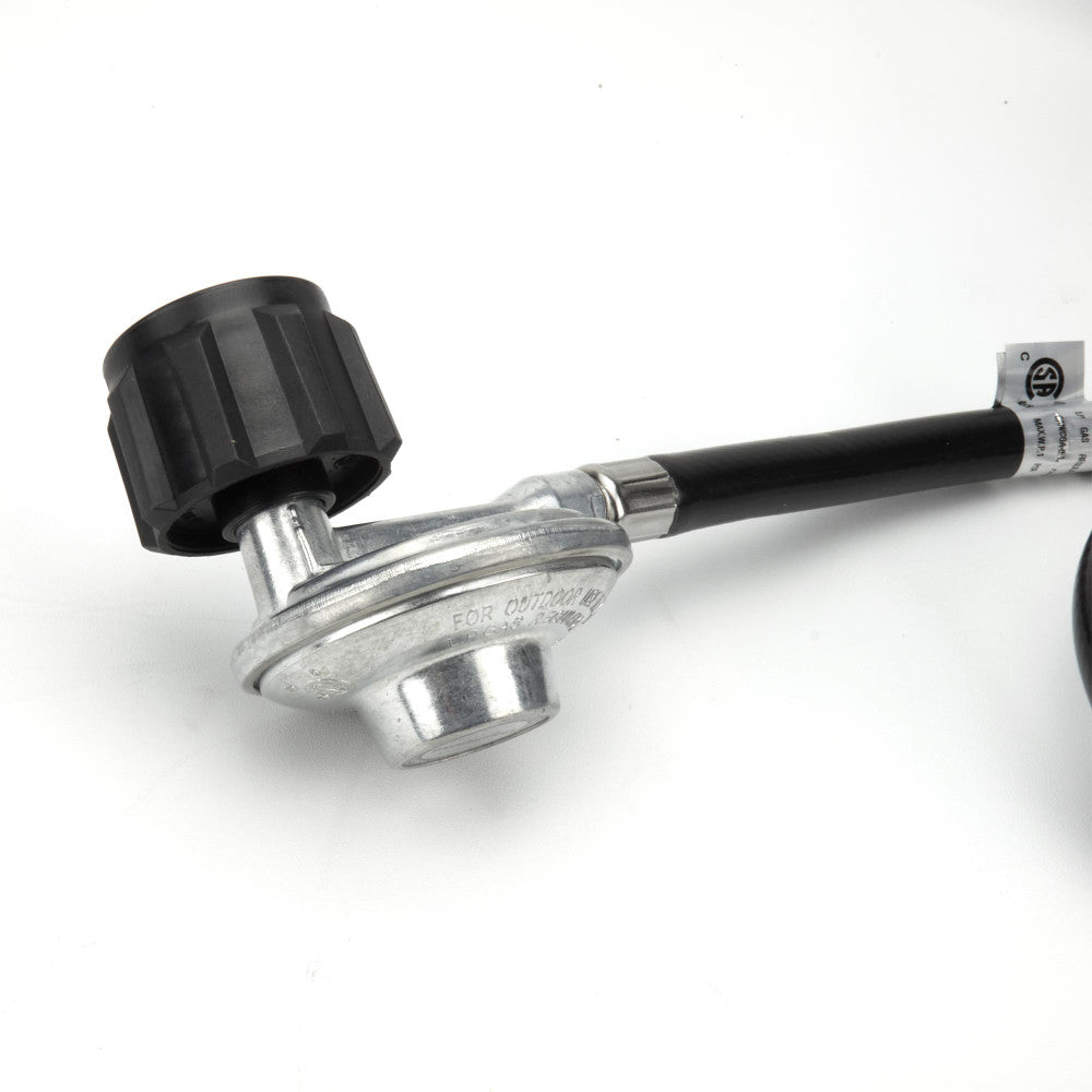 The propane regulator and tank connection of a Celestial CSA Certified Fire Pit kit. 