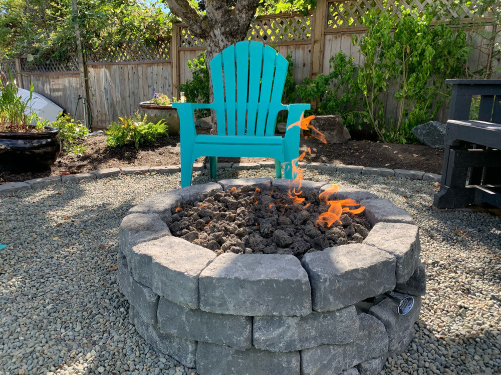 Paver fire pit with Celestial flat pan supporting the fire media