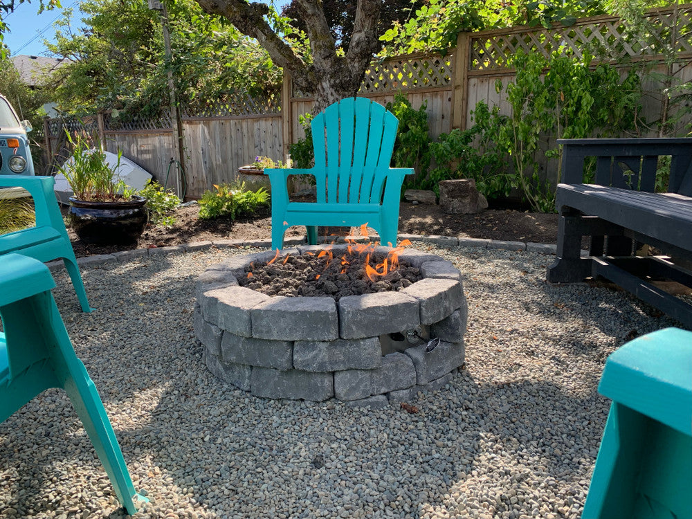Outdoor fire pit made with pavers, propane burner ring and Celestial Fire Glass Connection kit with mounting plate